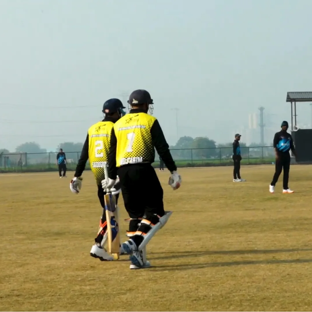 Cricket players celebrating a wicket